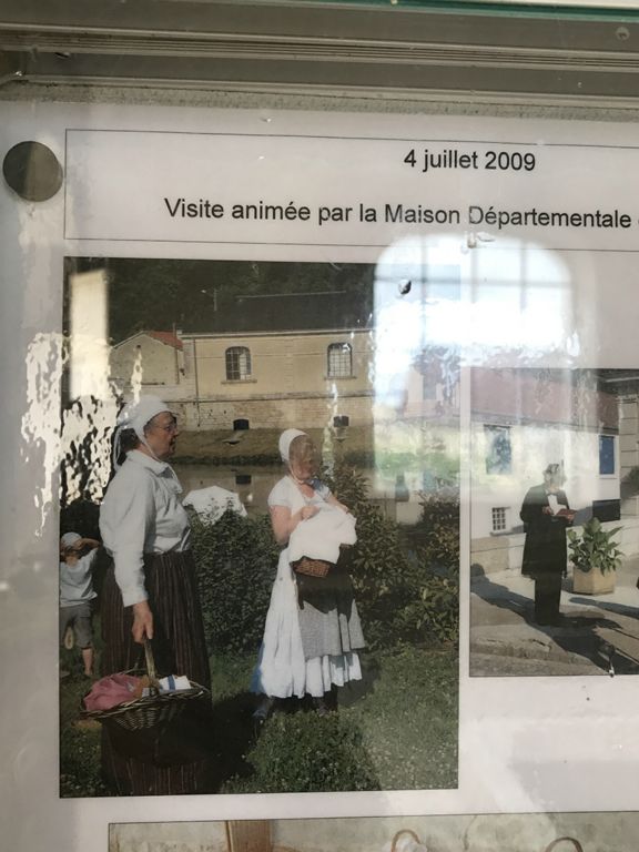 Signs inside the lavage at Vouécourt had photos to show re-enactments